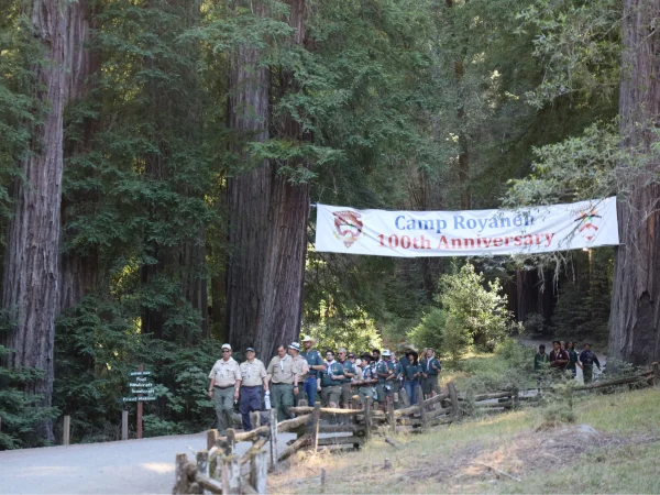 procession of eagle scouts under 100th banner