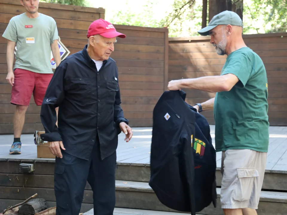 Gov. Brown receiving his T-Bird Circle jacket.